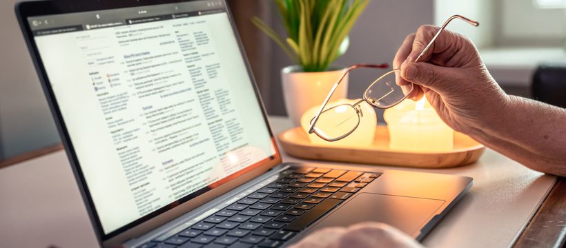 Client reviewing their case online on a laptop